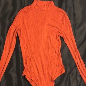 Burnt orange body suit